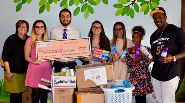 La Roche students presenting check to Ronald McDonald House